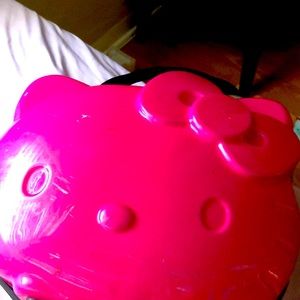 I am selling a hello kitty suite case it is pink with a zipper the zipper works.